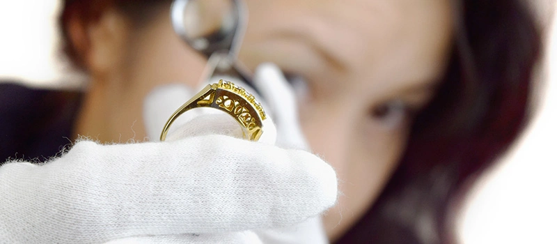 a ladies checking the gold